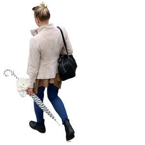 woman walking and carrying an umbrella seen from above