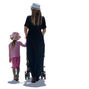 backlit mother and daughter walking