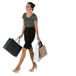 young smiling woman walking with many shopping bags