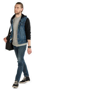 man in a jeans jacket walking