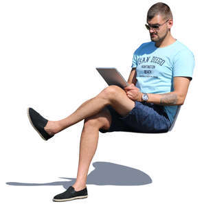 man sitting and reading smth on a tablet