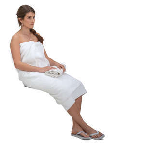 woman wrapped in spa towel sitting