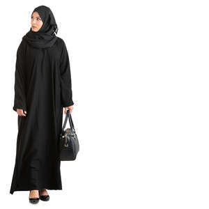 muslim woman walking and looking at smth