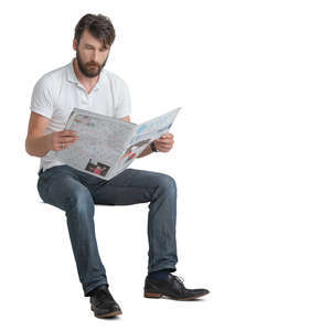 man sitting and reading a newspaper