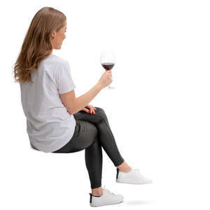 woman sitting and drinking wine