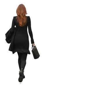 red haired woman ina a black dress walking