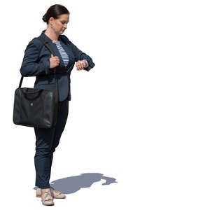 businesswoman standing and checking her watch