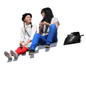woman and girl sitting on the stairs and talking