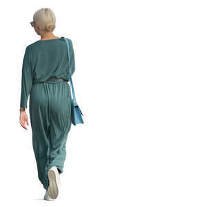 woman in a green jumpsuit walking