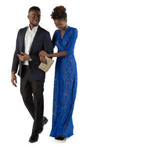 black man and woman in formal outfits walking arm in arm