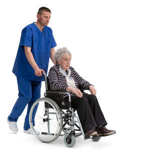 nurse pushing a woman in a wheelchair