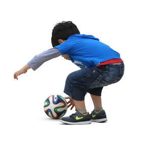 little boy playing with a ball