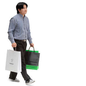 asian man with shopping bags walking