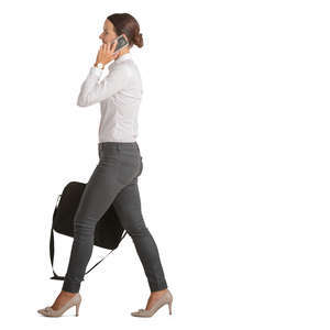 businesswoman walking and talking on a phone