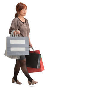 asian woman with shopping bags walking