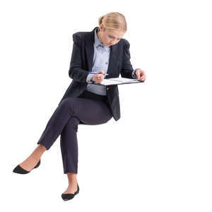 businesswoman sitting and writing notes