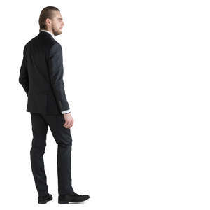 man in a black suit standing