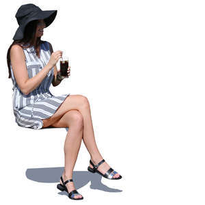 woman in a summery outfit sitting and holding a drink