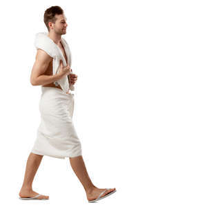 man in a white towel walking