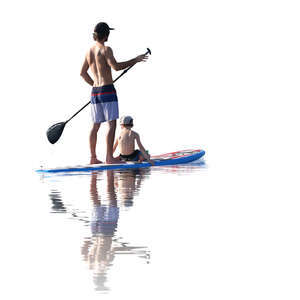 father and son paddleboarding