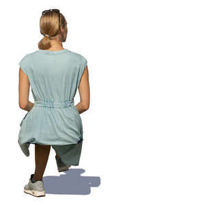 woman in a pale blue summer dress sitting