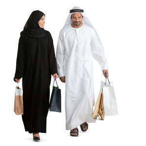 arab man and woman with shopping bags walking