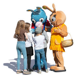 children talking with two big rabbits