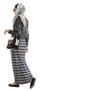 muslim woman in a black and white outfit walking