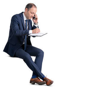 businessman sitting and taking notes