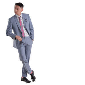 asian man in a grey suit standing