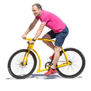 man riding a yellow bike