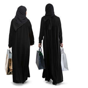 two arab women with shopping bags walking