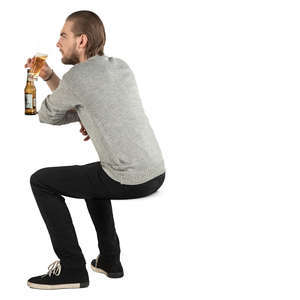 man sitting and drinking beer