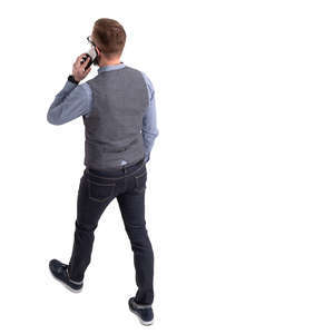 man walking and talking on a phone