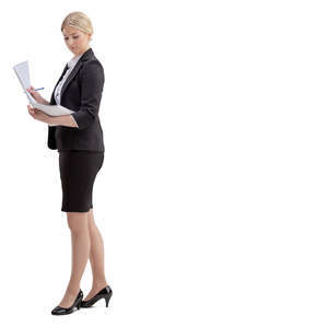 woman in an office standing and looking at papers