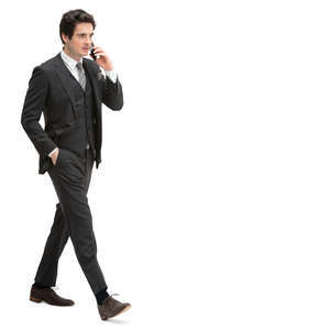 man in a formal black suit walking