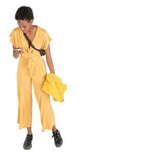 woman in a yellow jumpsuit standing