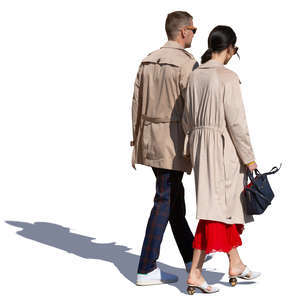 couple in brown overcoats walking