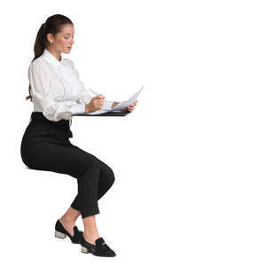 woman at the desk writing notes