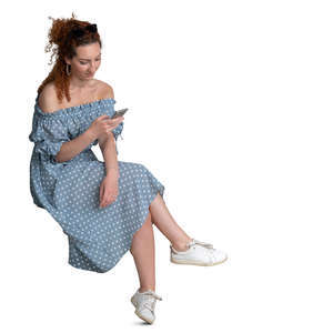 woman in a dotted summer dress sitting