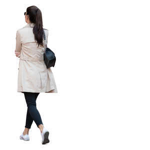 woman in a light overcoat walking