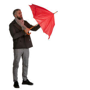 man opening a red  umbrella