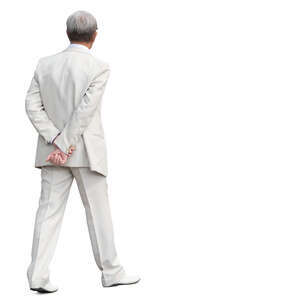 man in a white suit walking