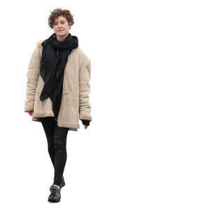 woman in a beige overcoat walking