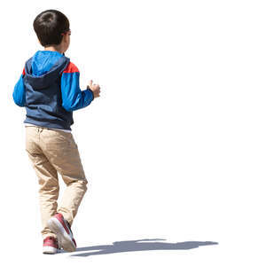 little boy with dark hair walking