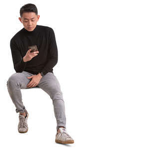 asian man sitting and texting