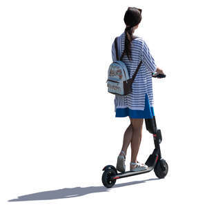 young backlit woman riding an electrical scooter