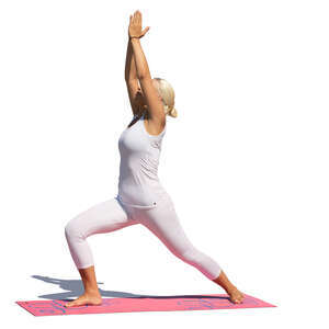 woman in a white sports outfit doing yoga