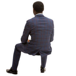 black man in checkerd suit sitting
