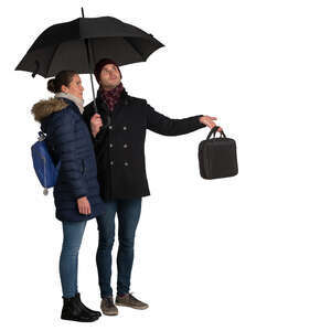 man and woman standing under the umbrella